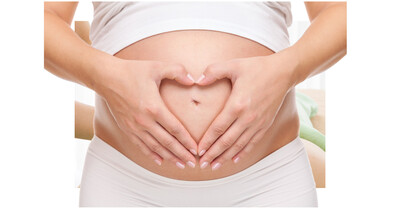heart shaped hands over mom's pregnant belly