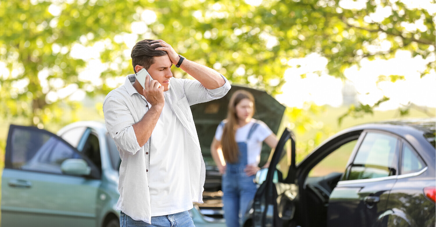 Man and woman stressed after auto accident