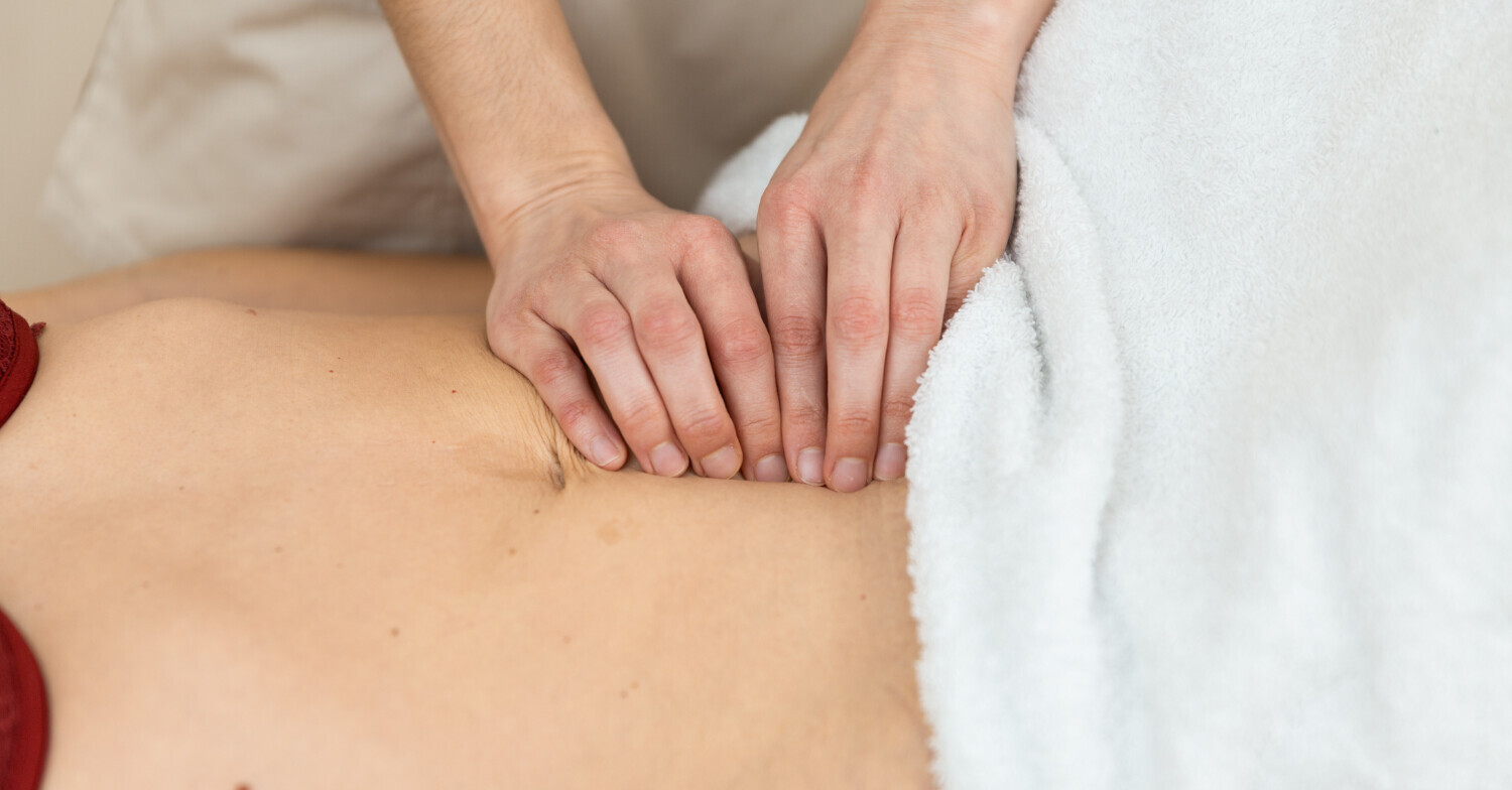 Postpartum back pain that won't resolve may be diastasis recti — not a spine problem.