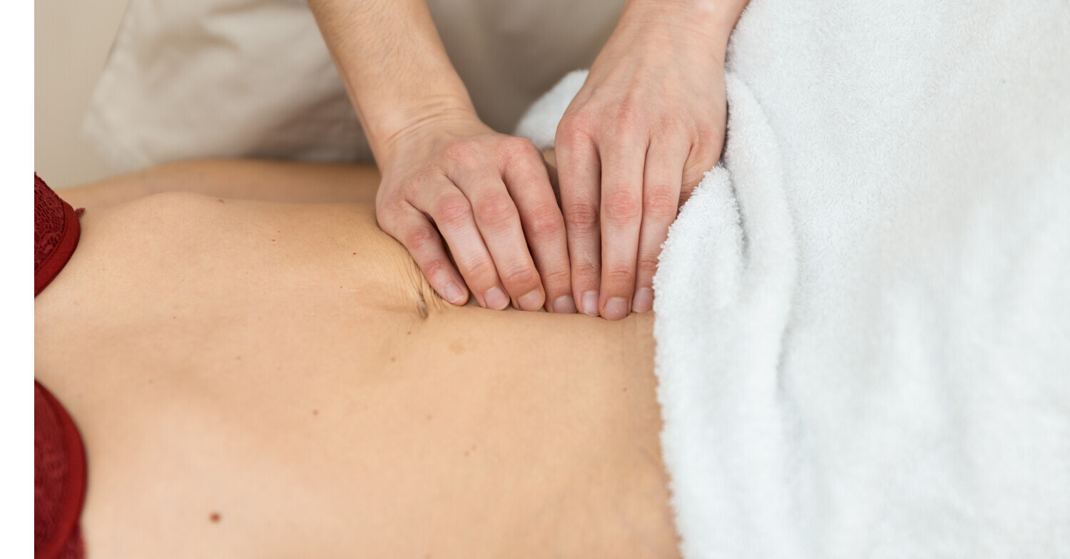 Woman being checked for diastasis recti